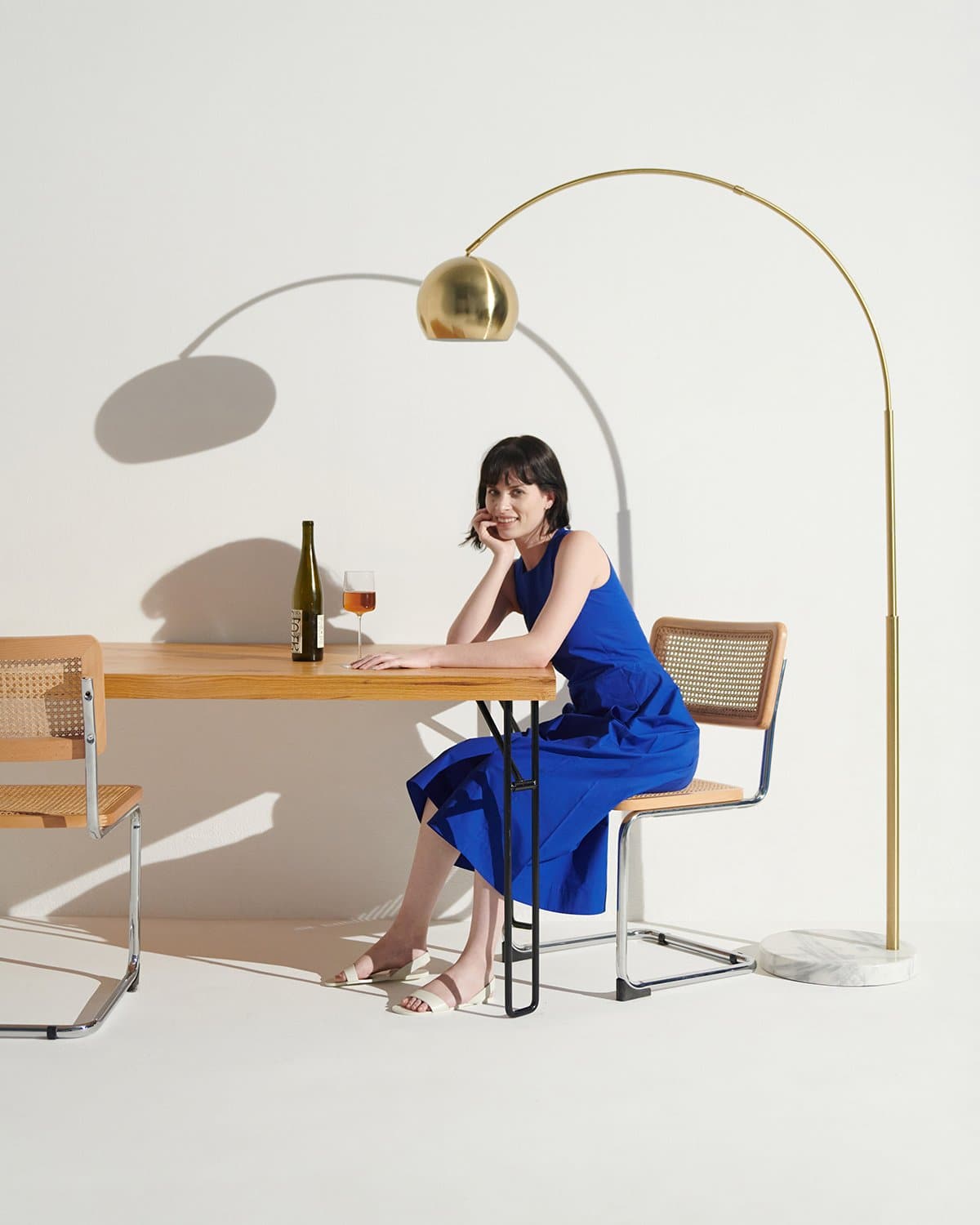 Olivia Floor Lamp with a marble base, arching swoop graceful